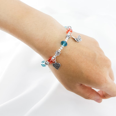 Vòng tay mệnh đá pha lê mix charm hoa+ tim