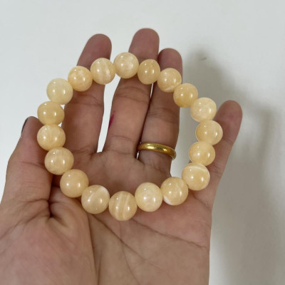 Vòng tay chuỗi hạt ngọc thật màu vàng cam cho người mệnh Thổ và hỏa đường kính hột 10 li (1cm)